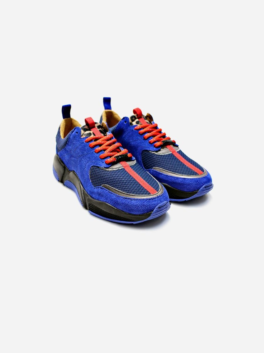  Blue sneakers with mesh panel with orange and red details. Two-toned sole. Interior in leather. Lace closure. Pull tab at back.